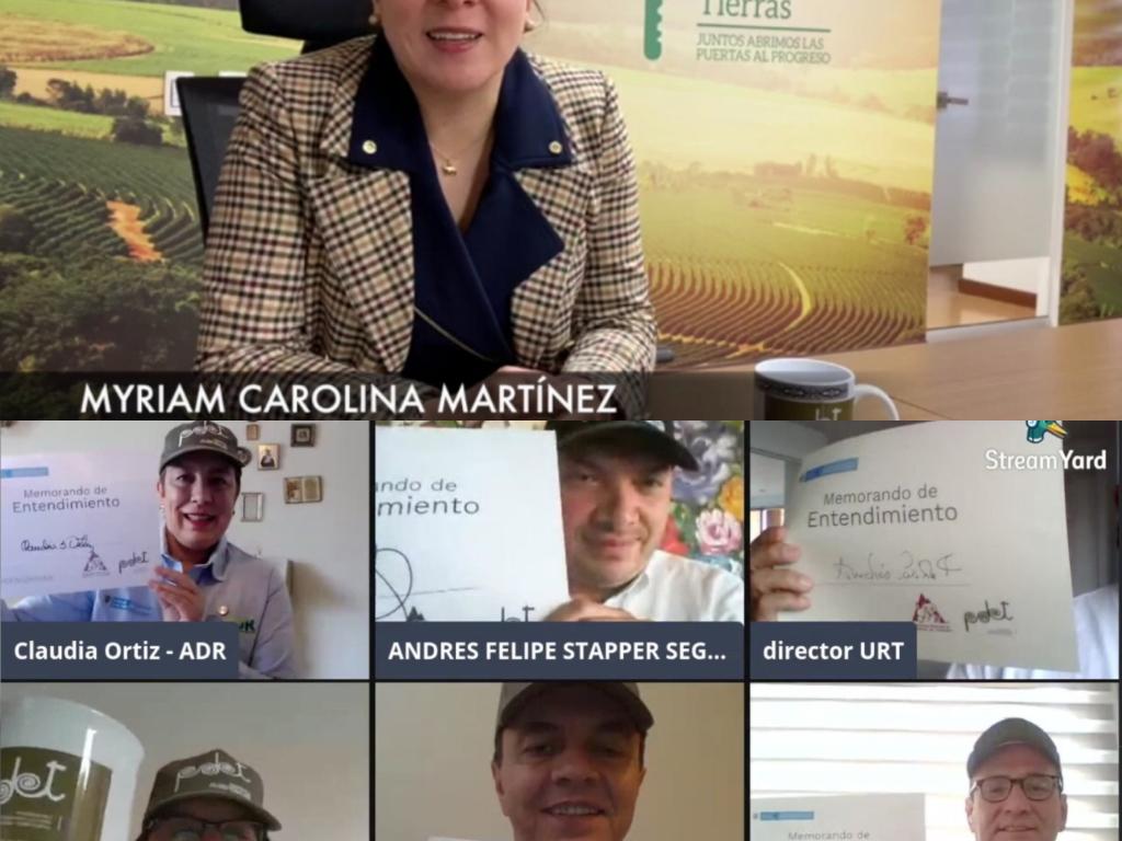 La Directora de la ANT, Myriam Martínez Cárdenas, aparece en video llamada con 6 funcionarios de la Federación de Cafeteros, ellos mostrando cada uno el memorando de entendimiento.